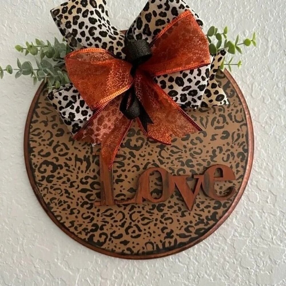 Love animal print‎ wall hanging with orange accents